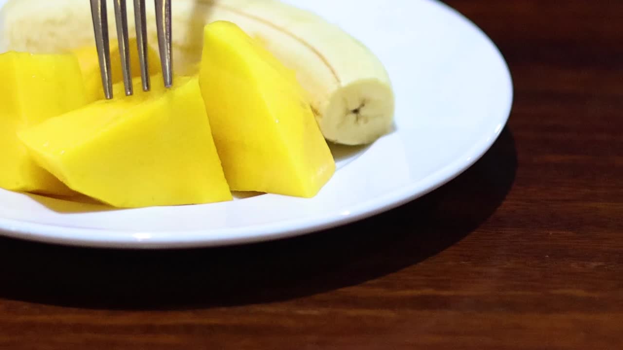 Plate of Sliced Mango and Banana