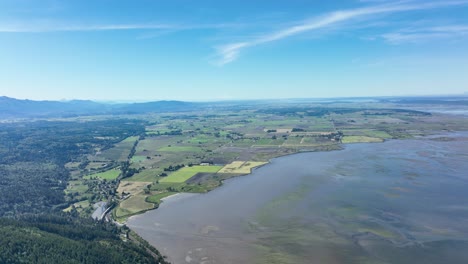 Drone-shot-over-Samish-Bay-in-with-some-of-Washington-State's-most-fertile-soil-in-being-farmed-along-the-shore