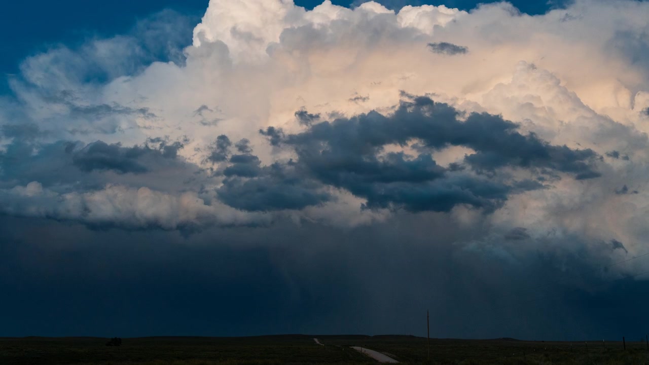Lightning storm cloud flashing in the night sky timelapse