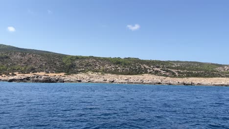 View-of-sea-waves-reaching-sandy-beach-with-crystal-clear-water-and-sandy-coastline-which-offer-you-tropical-exotic-beach-feeling-with-its-natural-untouched-beauty-in-North-Cyprus