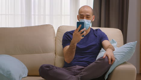 man with protection mask on a video call