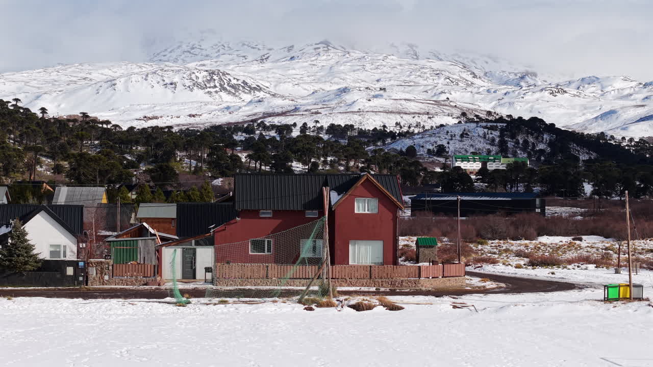 Peaceful winter village neighbourhood in Caviahue beneath majestic mountains