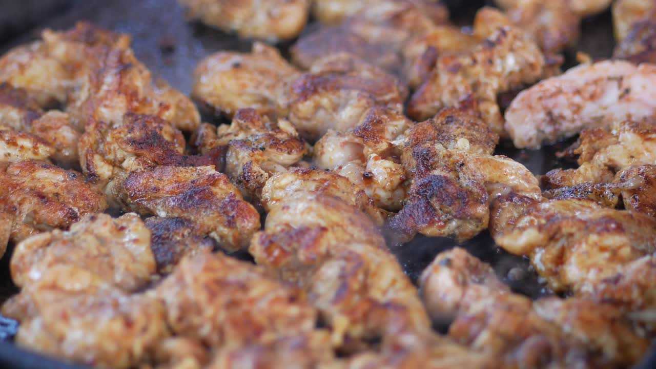 Grilled Chicken Pieces Cooking in a Pan