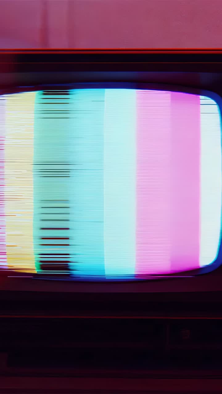 Vertical video: Flickering CRT TV showing color bars in studio, signal causing scanline glitches