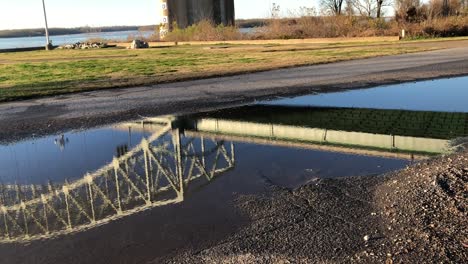 bridge reflection in a puddle