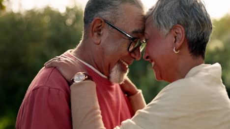 Senior-couple,-love-and-forehead-touch-in-garden