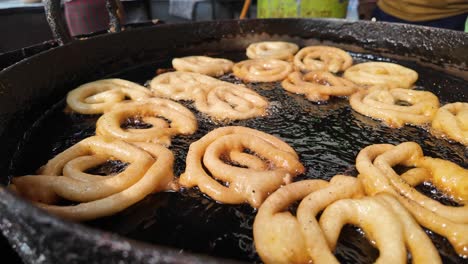fried jalebi in a pan