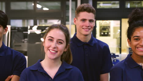 portrait of engineering apprentices in factory