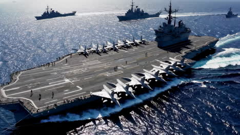 aircraft carrier and escorts at sea