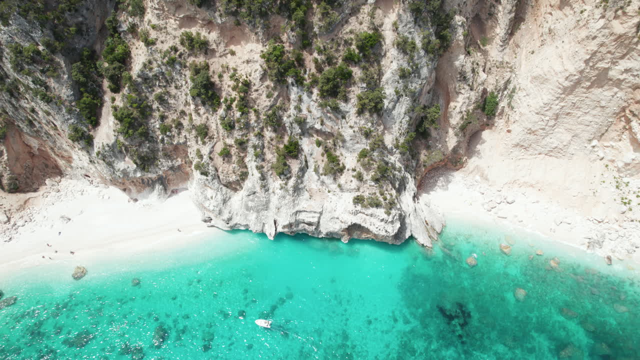 Aerial drone video of tropical paradise beach in summer in the mediterranean, Cala Mariolu, Sardinia, Italy