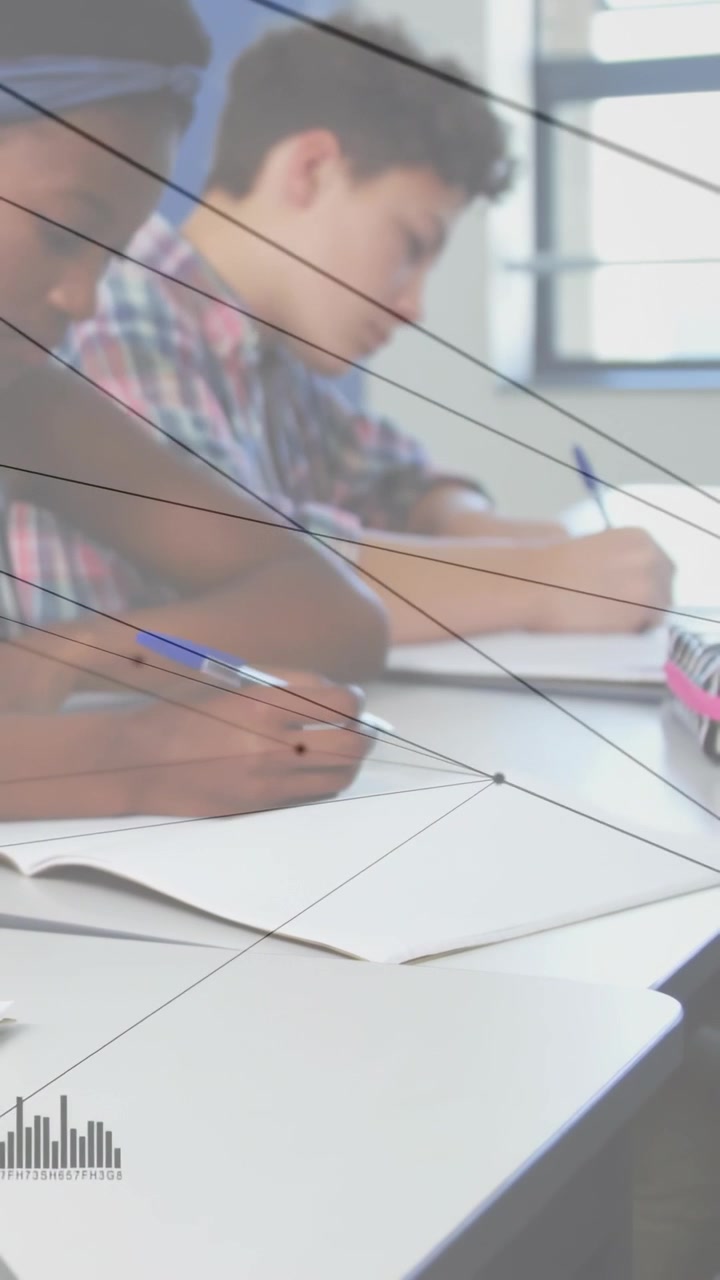 Vertical video: Two students writing, camera pulling back showing desk, nodes tracking pens school