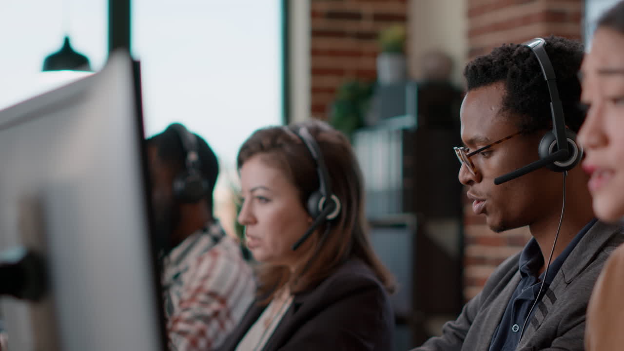 Male call center operator using headset to help people