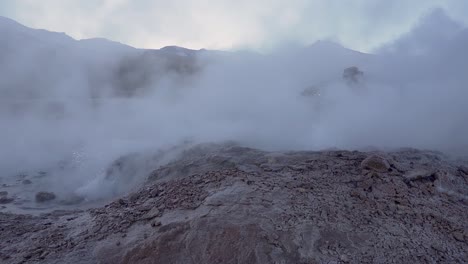 el tatio geysers eruption before sunrise in the atacama desert in chile, south america