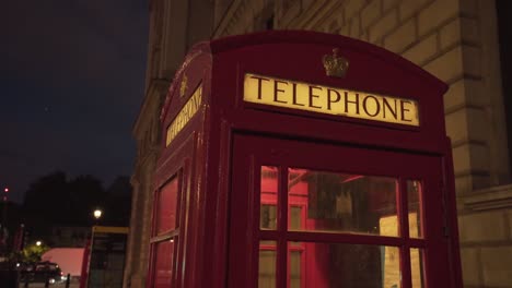 close view of typical beautiful unique london red telephone cabin at night time