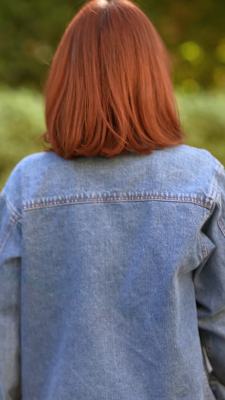 Woman wearing a denim jacket