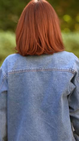 woman wearing a denim jacket