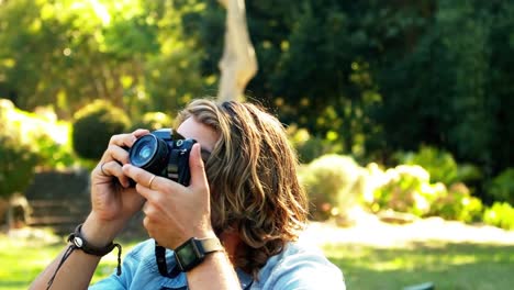 man photographing with camera