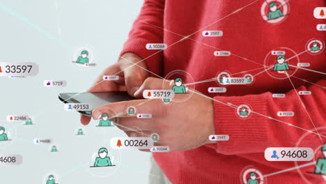 animación de iconos de los medios sobre un empresario caucásico que usa un teléfono inteligente en la oficina