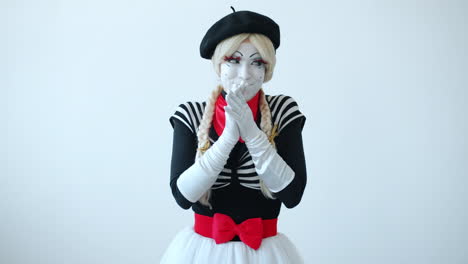 mime artist with clasped hands
