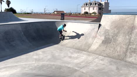 young skater doing tricks outdoors in estoril, cascais