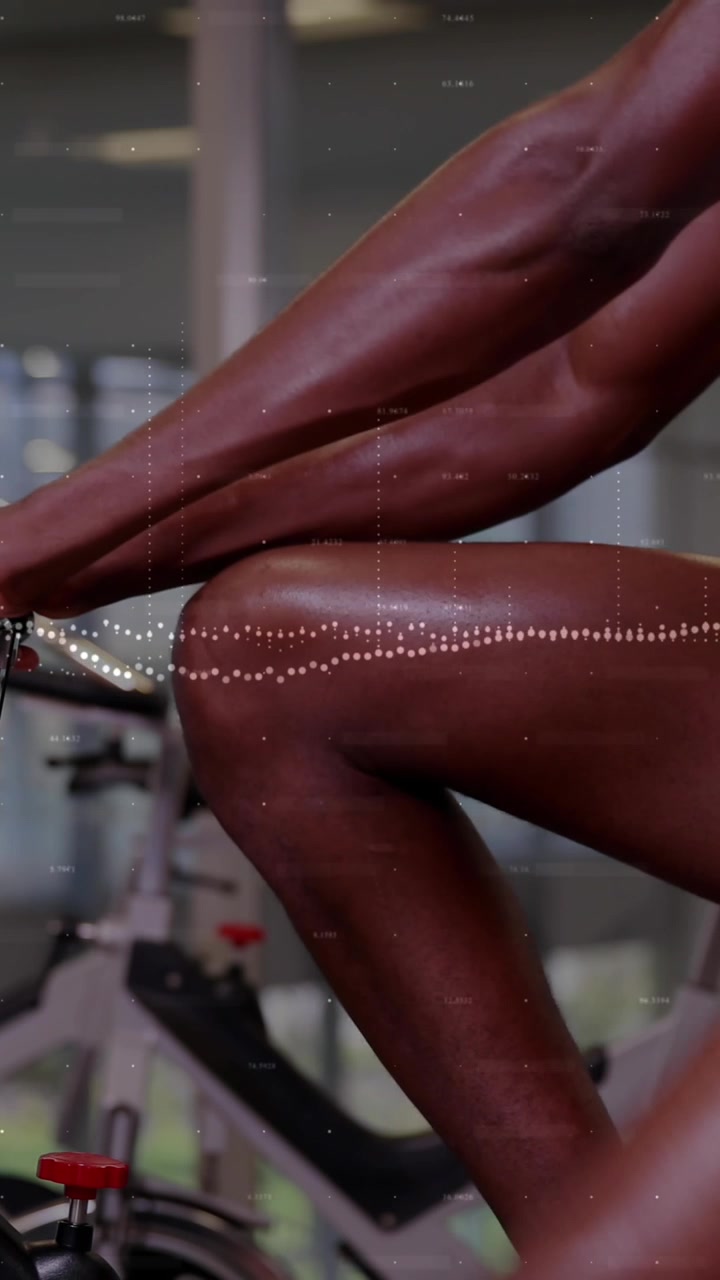 Animation of data processing over african american man exercising in gym