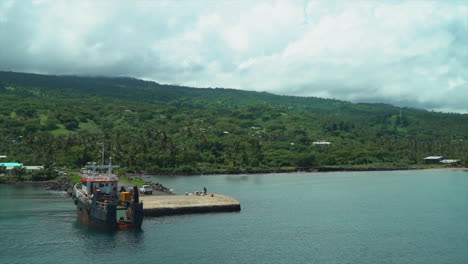 boat cruise fiji sea port marina garden island taveuni island pacific ocean shoreline beach front jungle rainforest christian catholic cross on hillside viti levu group landscape nature static slide