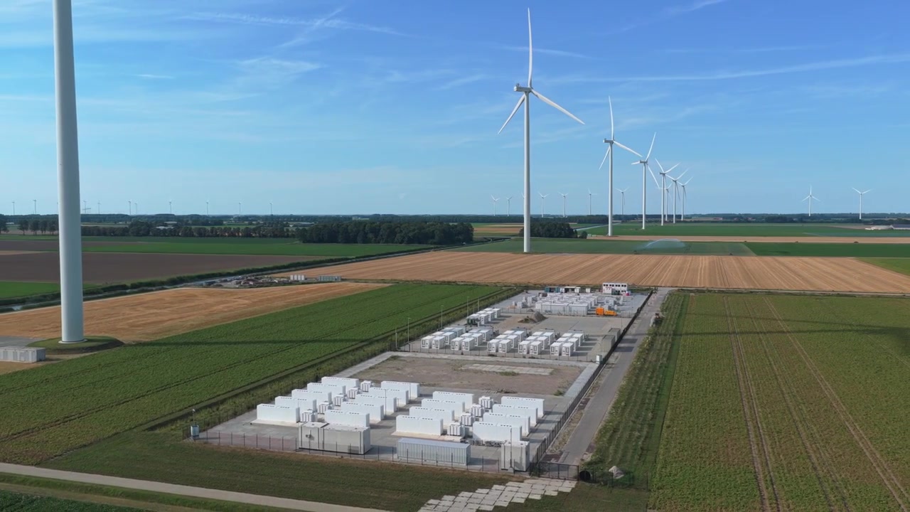 Battery energy storage system facility for a wind farm in dronten, netherlands. Aerial view of renewable green energy production and storage