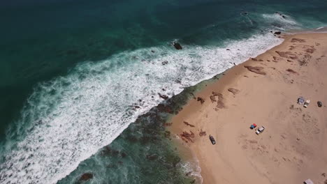 orbit drone footage of rocky beach at cabo san lucas, mexico