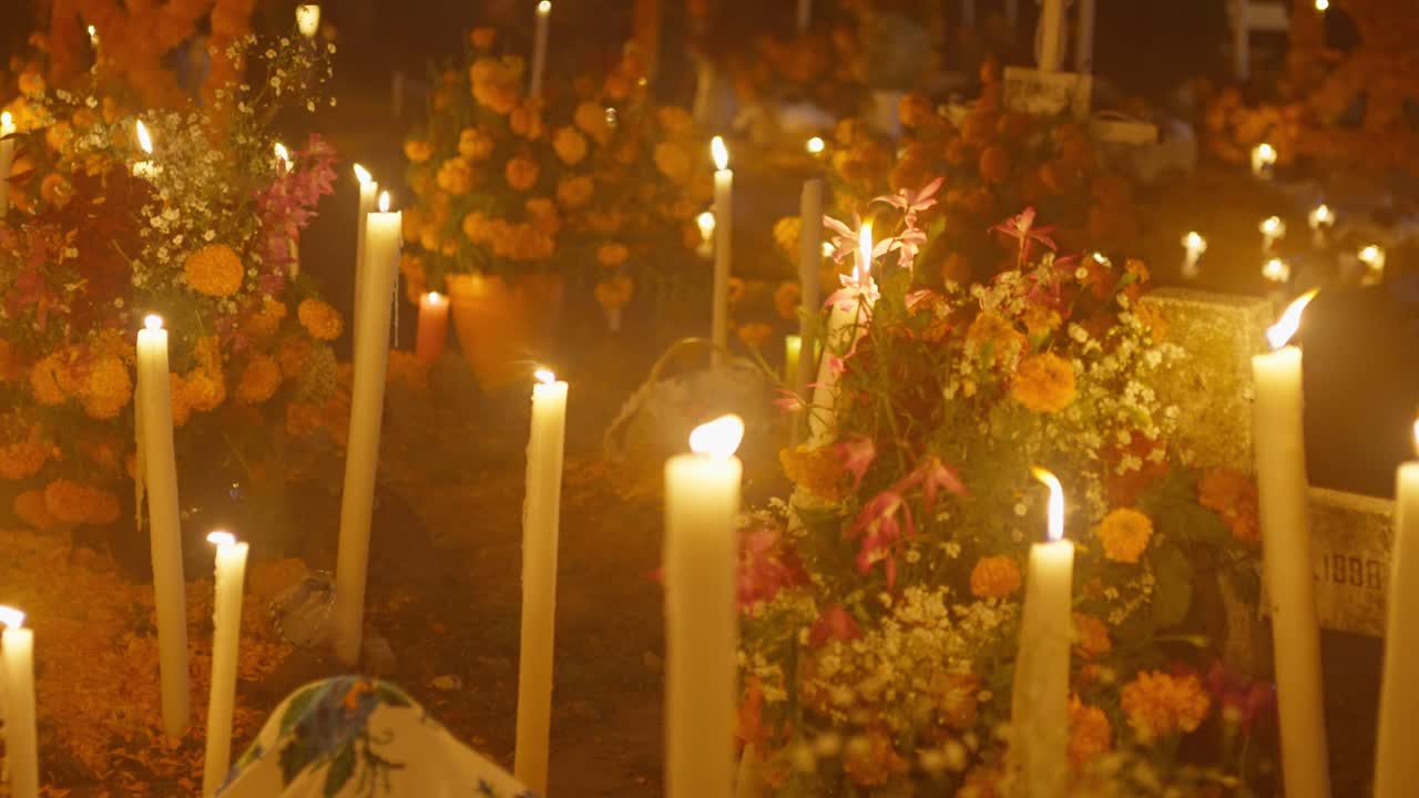 Candles and Flowers at a Day of the Dead Cemetery