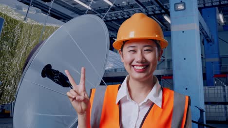 happy female engineer in a factory