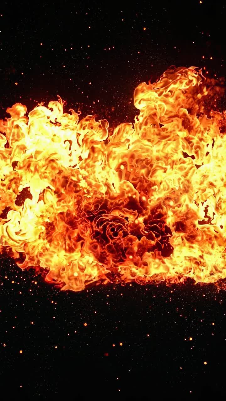 Dynamic video still of intense flames against a dark backdrop, captured from a low angle