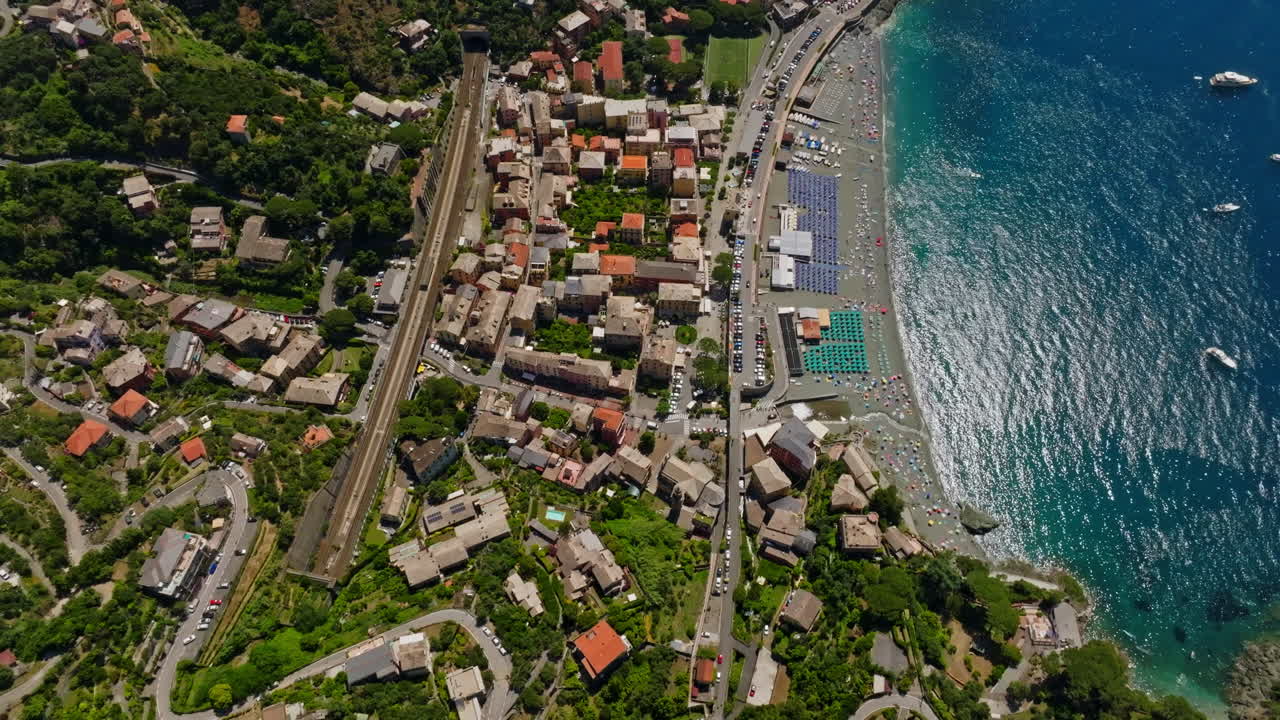High angle aerial rotating over the Bonassola town, summer in Liguria, Italy