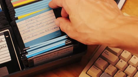 vintage floppy disks and hand