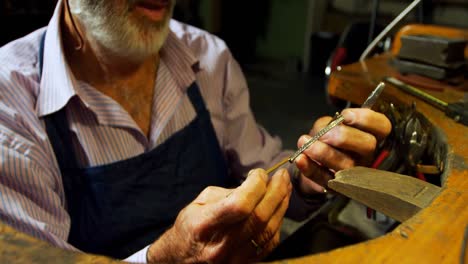 goldsmith manufacturing jewellery in workshop 4k