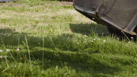 Lawn-Mower-Passing-Over-Sunny-Meadows-In-The-Backyard