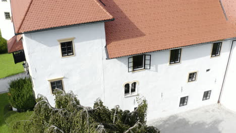 aerial - bogensperk castle in lower carniola, slovenia, ascending shot tilt down