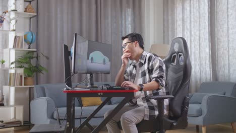 피곤한 디자이너가 작업장에서 잠을 자고 있습니다.