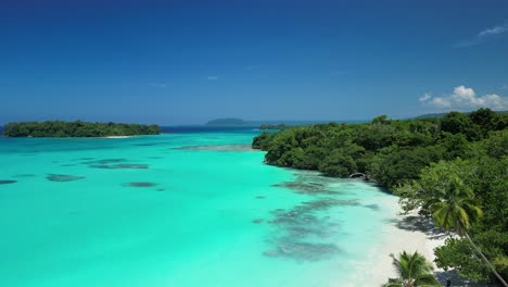 a drone reveals crystal clear waters at port olry on the island of espiritu santo