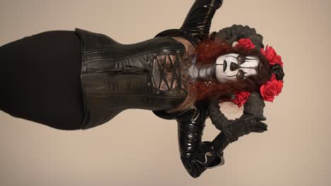gothic fantasy woman in black latex corset and horns