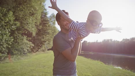 tracking video of son and father playing with a plane