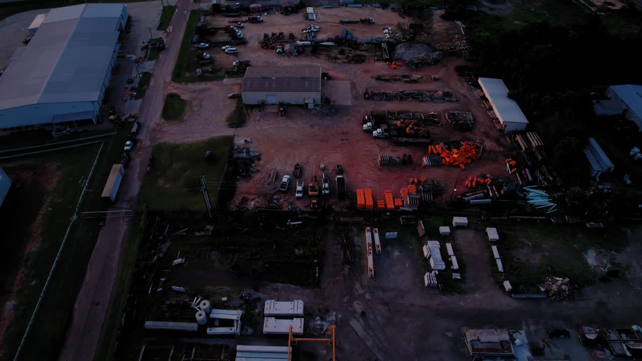 Aerial Shot of Large Industrial Supply Yard and Warehouse at Blue Hour Dusk. Alabama, USA