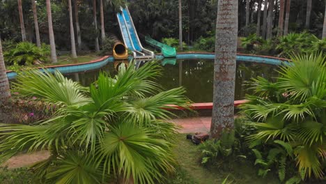 side panning shot of swimming pool at abandoned waterpark