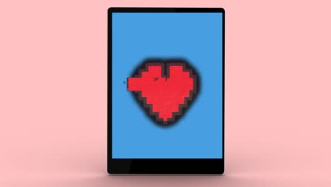 animation of heart icon over tablet