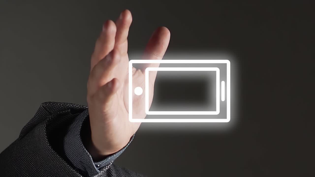 vídeo vertical: aparece un icono móvil digital blanco encima de la mano extendida