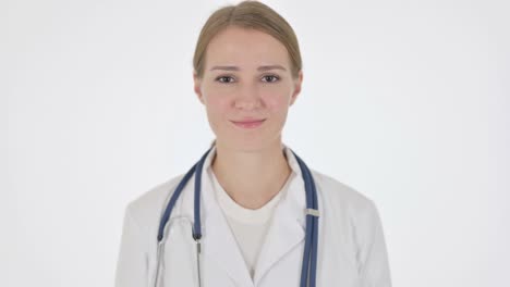 female doctor shaking head as yes sign on white background