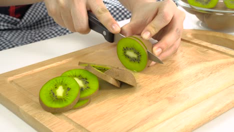 knife slicing fresh kiwi