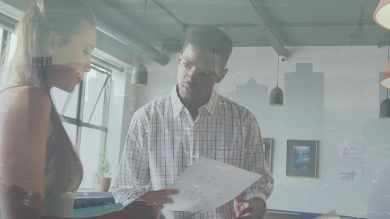 A group of diverse business people are discussing work during a meeting at the office