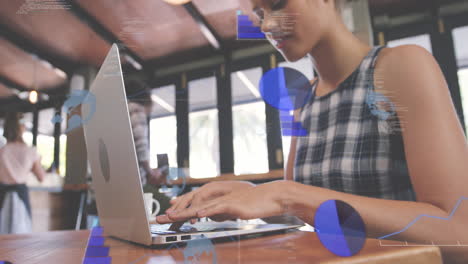 animación de gráficos y globos sobre vista de ángulo bajo de mujer biracial trabajando en computadora portátil