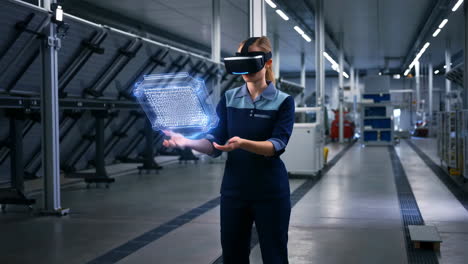 industrial worker uses vr headset to interact with holographic model in factory
