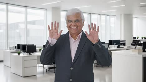 happy indian senior manager saying hello